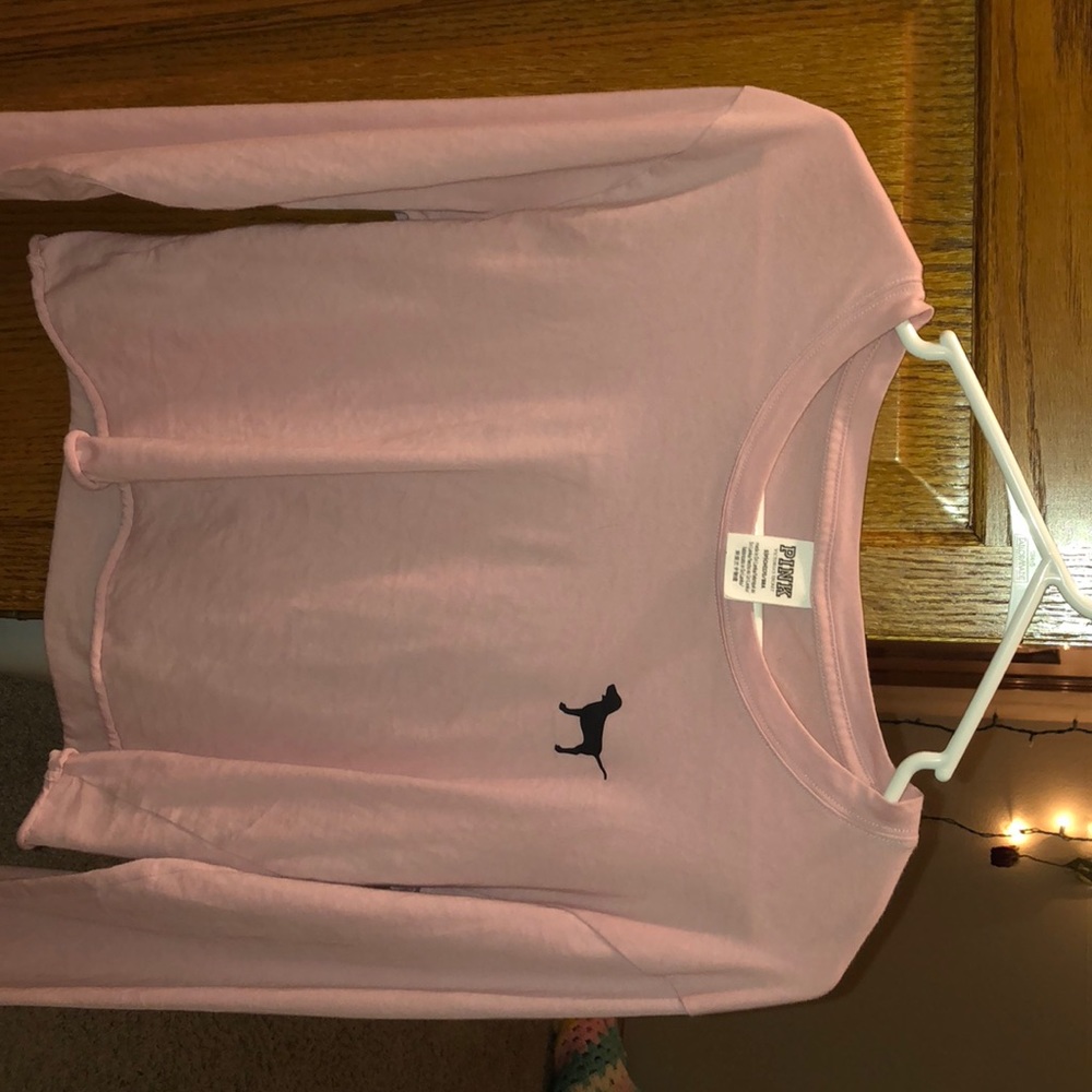 pink cropped long sleeve shirt